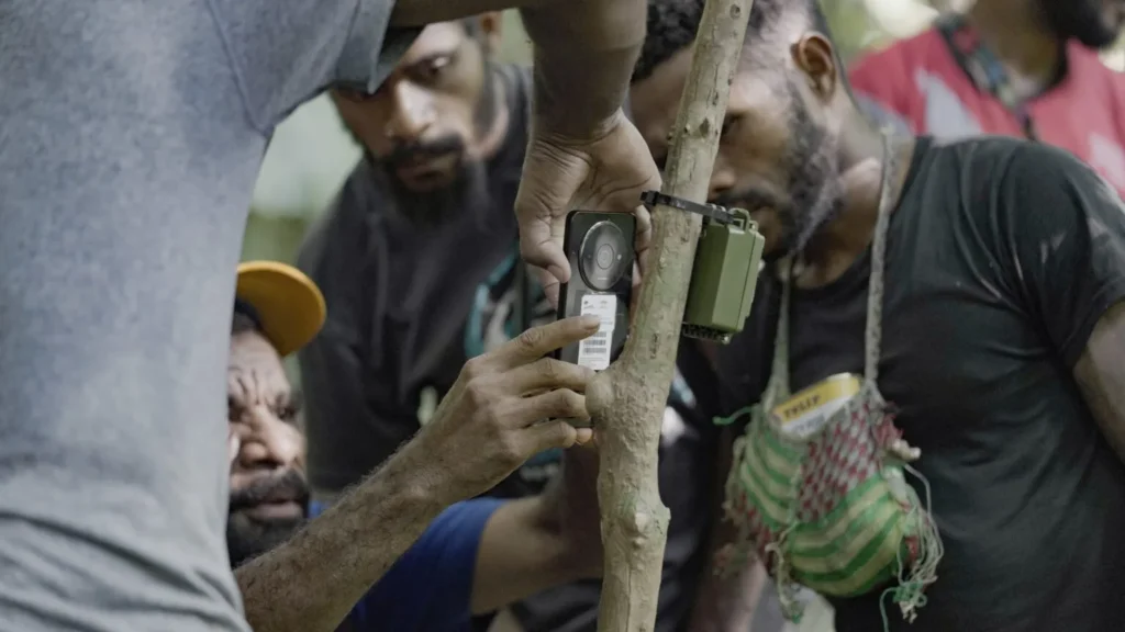 Biodiversity Team Leaders set up a sound recorder. Photo by Russell Wai / Landscape Alliance